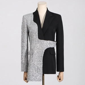 Detail showing the asymmetrical contrast between black fabric and silver sequin panels