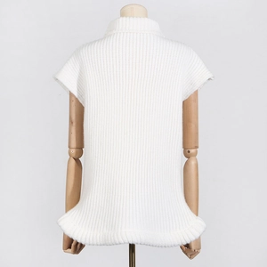 Detailed vertical ribbed knit texture on a white sleeveless mock neck sweater