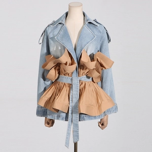 Detailed view of ruffled denim jacket with khaki fabric patchwork and waist belt