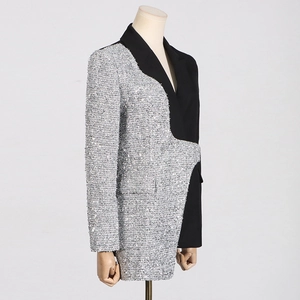 Detailed 45-degree side view of a slim-fit blazer with silver tweed patchwork detail