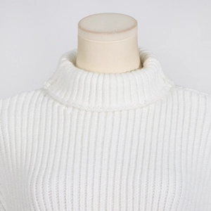 Detailed close-up of a white high-neck sleeveless knit sweater with rib texture