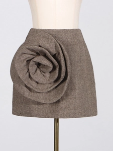 Elegant brown herringbone A-line mini skirt featuring a large 3D floral accent