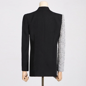 Detail view of contrast sequin sleeve on slim-fit black blazer for women stylish design