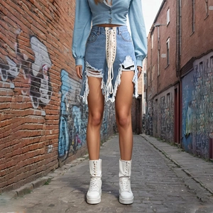 Detail of high-waist denim shorts featuring cross-lace design and frayed distressed edges
