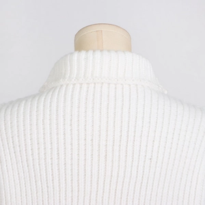 Detail of white mock neck sleeveless sweater showing vertical ribbed knit texture