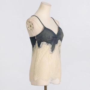 Detail of denim and lace patchwork camisole with side zipper on a mannequin