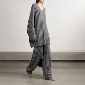 Detailed side view of grey knit set featuring wide ribbing and relaxed trousers