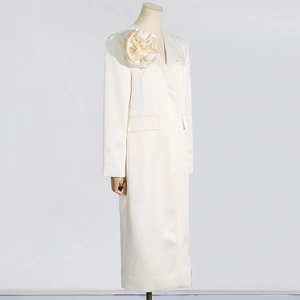 Detailed view of satin trench coat featuring a large 3D floral appliqué on the shoulder