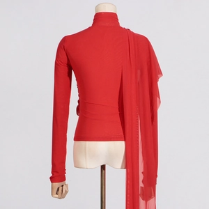 Detail of red slim fit top featuring a high neck and long decorative mesh shoulder ribbons