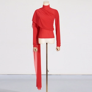 Detail of red slim-fit mesh top featuring pleated high collar and long flowing ribbon