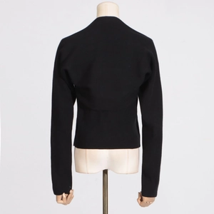 Detailed back view of a black ribbed knit long-sleeved cardigan with vertical texture