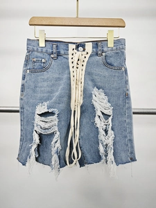High waist light blue denim shorts with cross lace-up ties and ripped distressed details