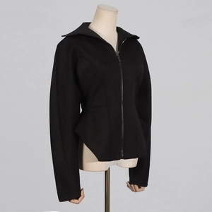Detail of a slim fit black jacket featuring a wide lapel and a unique curved hemline