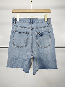 High waist light blue denim shorts featuring frayed hems and back pockets for casual wear
