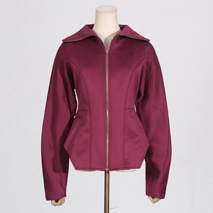 Detail of burgundy slim fit jacket featuring asymmetrical geometric hem and metal zipper