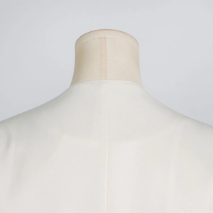 Close-up detail of the white floral trench coat back seam and smooth woven fabric texture