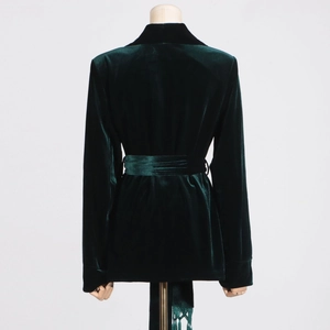 Back view of velvet blazer in dark green with belted waist design for women
