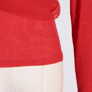 Detail of red mesh top showing precision double-stitch sewing and sheer fabric texture