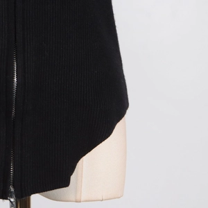 Detail shot of black ribbed knit fabric featuring a high-quality silver metal zipper