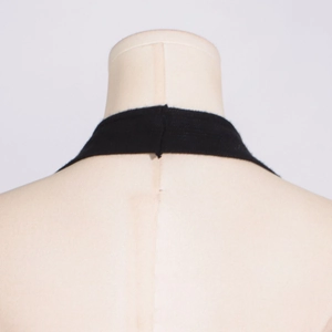 Detail of black halter neckline with fine knit texture on a mannequin