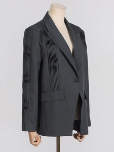 Charcoal grey women's tailored blazer featuring structured pleats and single button closure