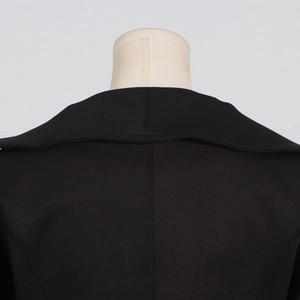 Detail of the high-quality back collar and stitching on this sleek black women's jacket