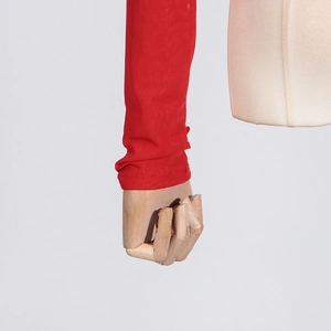 Detailed close-up of red high-elastic knit sleeve cuff on a long-sleeve mesh top