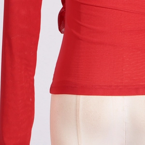 Detail of red slim fit mesh t-shirt featuring elegant pleats and stretchy knitted texture