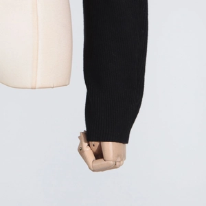 Close-up of black ribbed knit long sleeve showing detailed texture and soft material