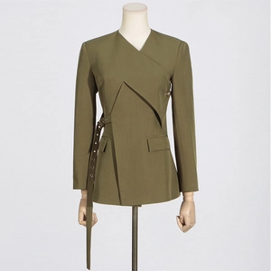 Detail of olive green blazer featuring asymmetrical front with metal eyelet waist belt