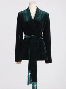 Elegant dark green velvet wrap blazer featuring a shawl collar and fringed belt detail