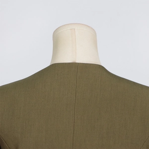 Close-up of the olive green blazer's back neckline and high-quality woven fabric texture
