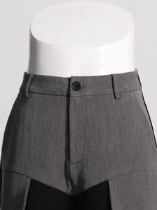 Fashionable grey and black patchwork straight leg trousers with button waist detail