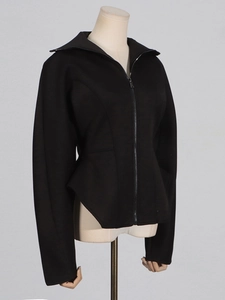 Black peplum jacket with wide lapels and slim fit design on a studio mannequin