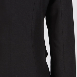 Detailed view of high-density black trench coat fabric and professional stitching