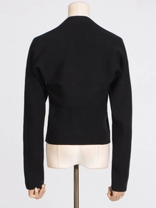 Back view of a black ribbed knit long-sleeve top with slim-fit design for women