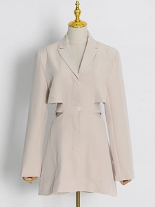 Beige blazer dress with waist cut-outs, long sleeves, and a classic notched lapel