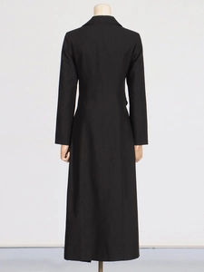 Elegant slim fit long black trench coat for women featuring a sleek back cut and lapel design