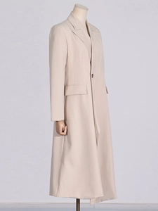 Beige mid-length British style single-breasted trench coat for women with classic notch lapels