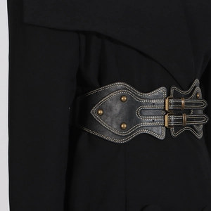 Detail of a black leather corset belt with vintage buckles and contrast stitching