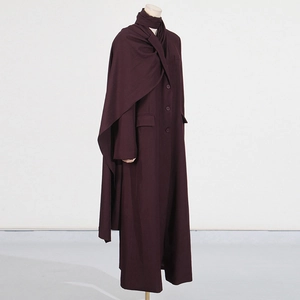 Detail view of burgundy minimalist long trench coat with matching scarf wrap