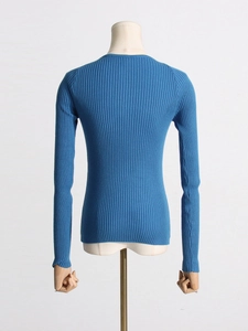 Back view of a blue slim-fit ribbed knit top with long sleeves and round neckline
