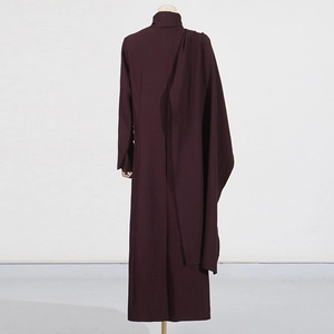 Detail of elegant back drape and pleated texture on deep burgundy long sleeve dress