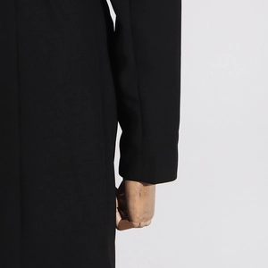 Detailed close-up showing the premium thick texture and precise stitching of the black coat sleeve