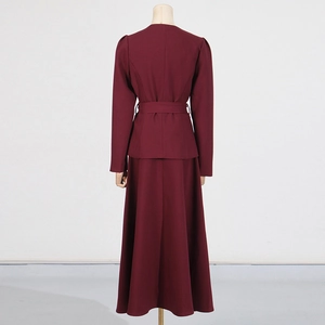 Back view of a slim-fit burgundy two-piece suit set with belted top and maxi skirt