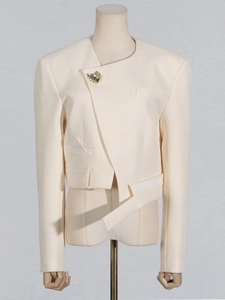 Chic off-white asymmetrical blazer with shell brooch and deconstructed silhouette