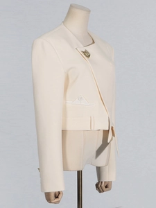 Chic cream asymmetrical blazer with gold shell accents and minimalist pocket design