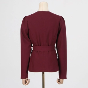Back view of burgundy slim fit blazer with matching waist belt and subtle puff sleeves
