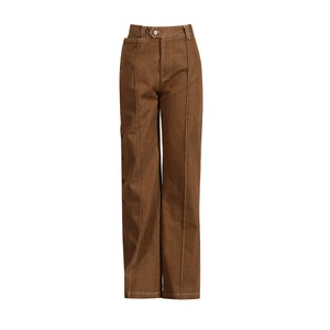 Detail of brown wide-leg pants featuring asymmetric waist closure and side button accents