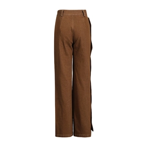 Detail of brown high-waist wide-leg trousers featuring durable twill fabric and belt loops